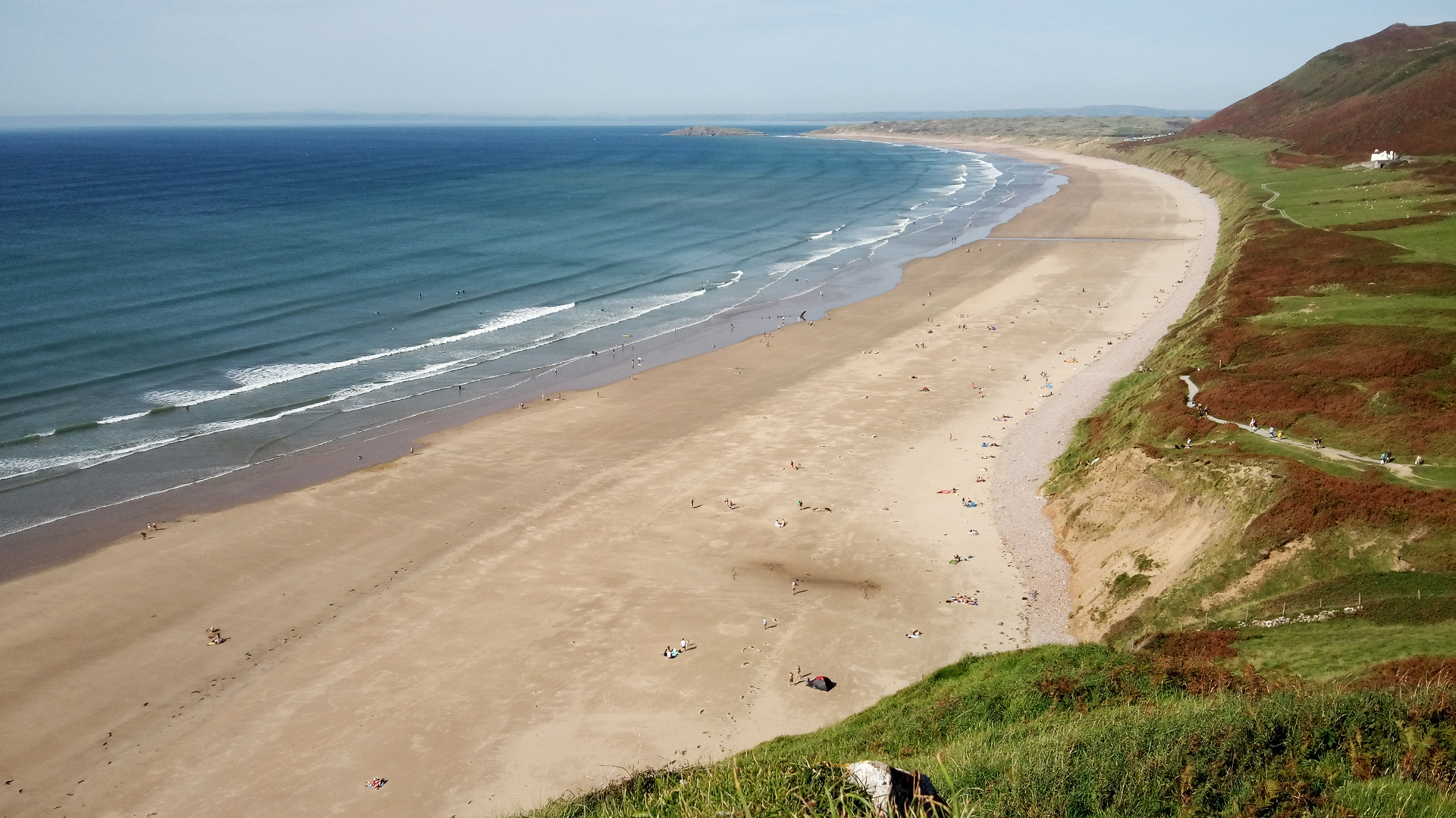 Looking down to Rhossili beach and the gentle surf from Worms Head path